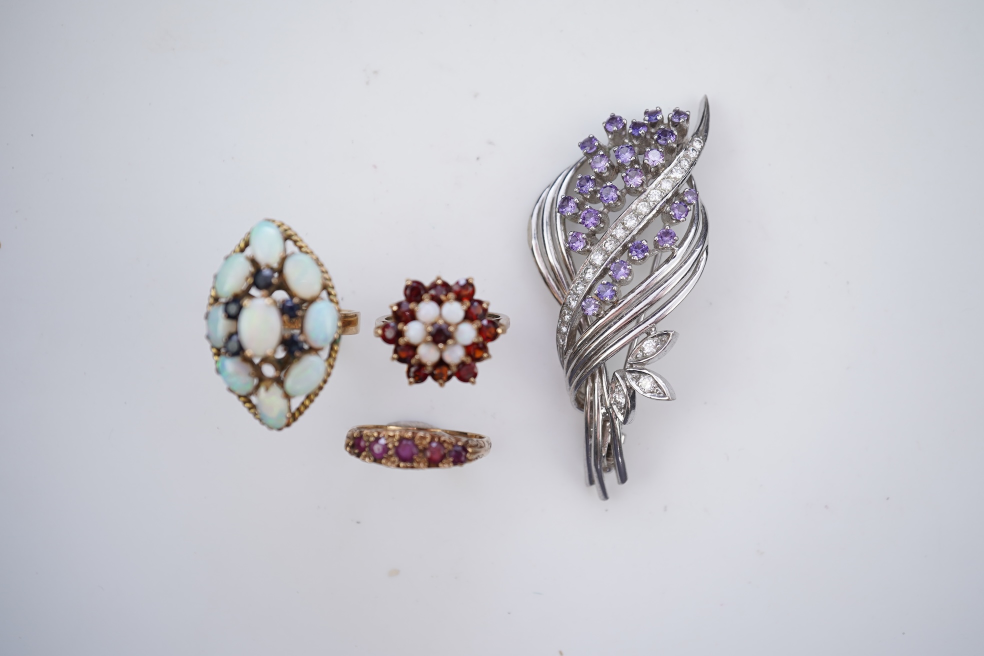 Three rings and a brooch